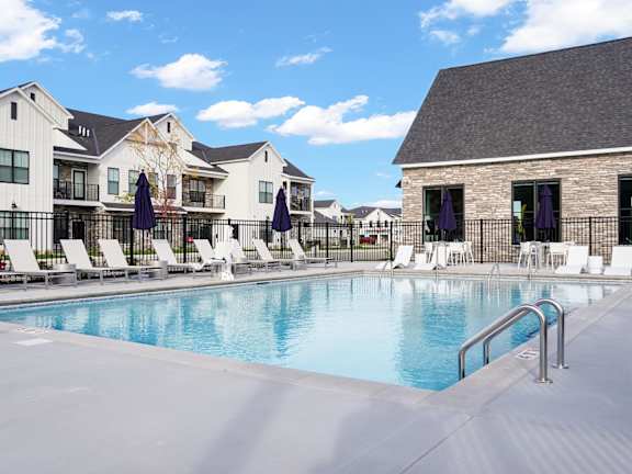 Modern townhome style apartment buildings with garages at Wildwood Lakeville Apartments, Lakeville, MN