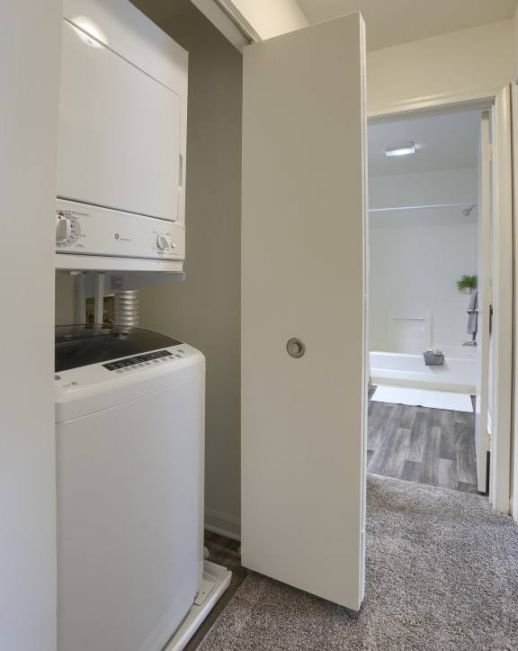a small laundry room with a washer and dryer
