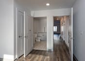 Thumbnail 5 of 7 - A white bathroom with a toilet and sink.