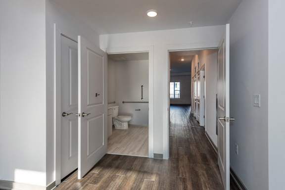 A white bathroom with a toilet and sink.