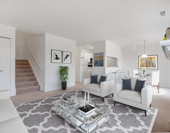 Living Room With Loft Staircase at Brownstones, Novi