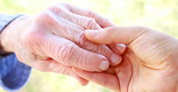 Holding hands at Savannah Grand of Sarasota, Sarasota, FL, 34238