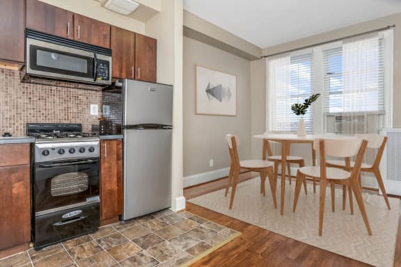 a kitchen and dining area in a 555 waverly unit