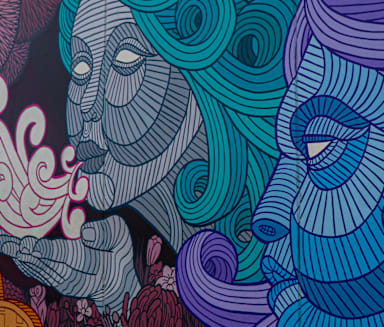 a mural with blue and purple colors on a wall at Tyler Street Stacks, Minneapolis
