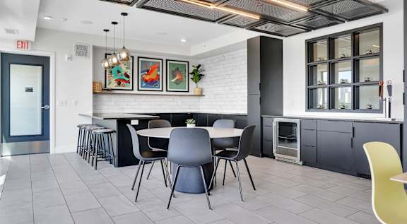 a rendering of a communal area with a table and chairs at Tyler Street Stacks, Minnesota
