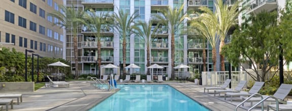 a swimming pool in front of an apartment building  at Vue, San Pedro, CA, 90731