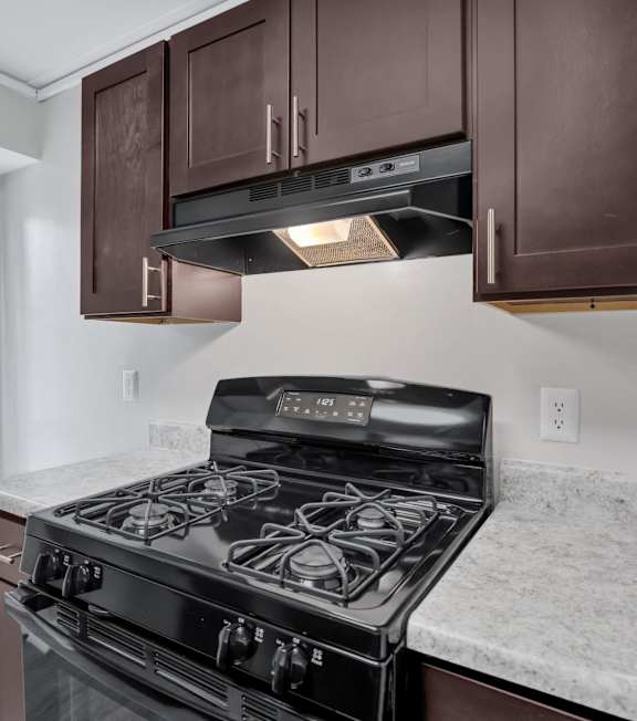 the kitchen of a home with a stove and cabinets