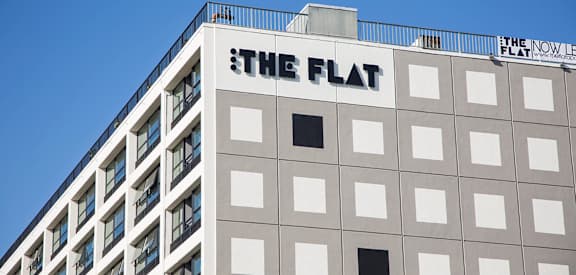 the flat apartment building with the flat sign on top of it at The Flat in Los Angeles, California