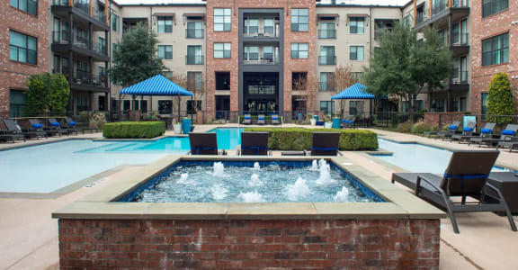 our apartments have a large pool and a courtyard with lounge chairs