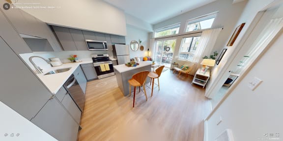 a view of a kitchen and dining area from the living room