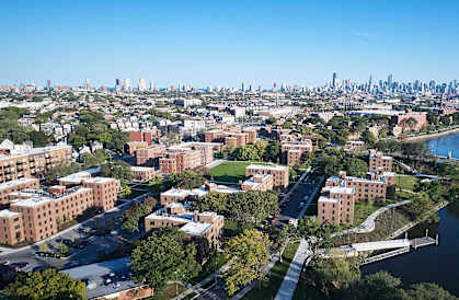 an aerial view of the city and the river
