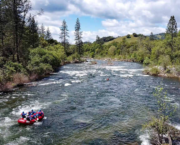 A group of people are rafting down a river.