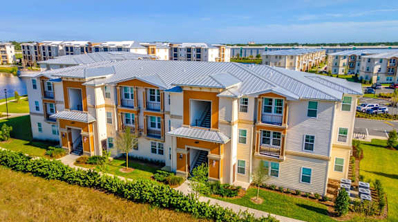 A large apartment complex with multiple buildings and green lawns.