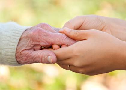 Holding A Hand Of A Senior at Savannah Cottage of Lakeland, Lakeland