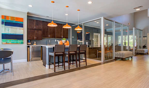 A modern kitchen with a dining table and chairs.