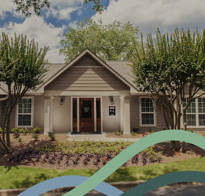 a house with a green ribbon in front of it
