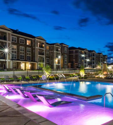 Outdoor Pool and Sundeck at Night at Abberly at Southpoint Apartment Homes by HHHunt, Virginia 22407