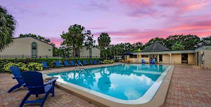 Swimming pool and sundeck at Oasis at Bayside Apartment in Largo, FL