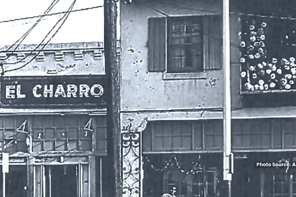 a black and white photo of the side of a building