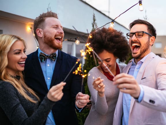 a group of people celebrating at a party at Scottsdale Hayden Townhomes, Scottsdale, AZ, 85257