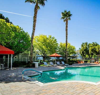 Octave Apartments in Las Vegas, Nevada Clubhouse Exterior and Pool with Lounge Chairs at Octave Apartments, Las Vegas, 89123
