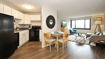 a kitchen and living room in an apartment