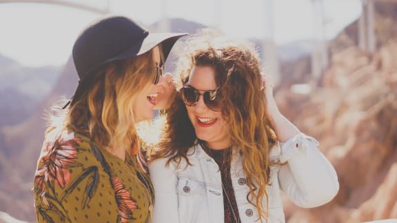 a couple of women standing next to each other