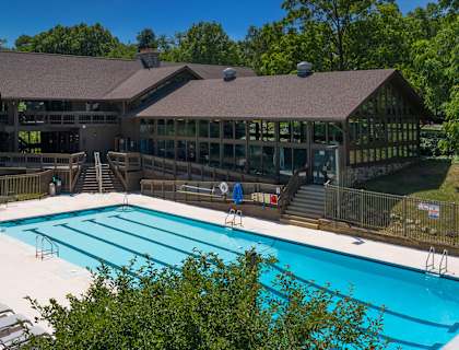 a large building with a pool in front of it at Willow Creek Apartment, Kalamazoo, MI, 49008
