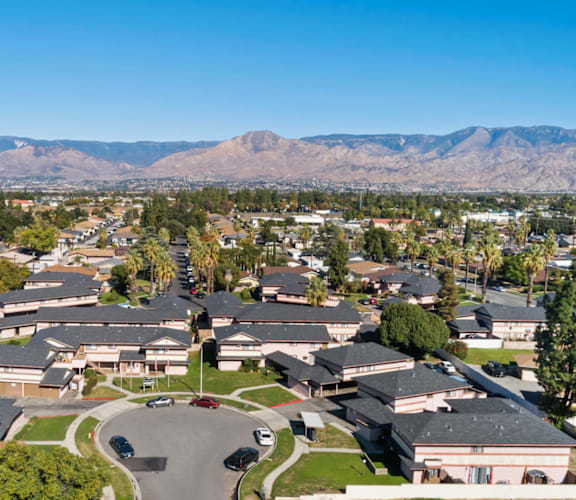 A large, well-maintained residential area with houses and a clear sky.
