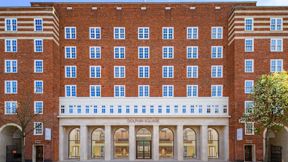 A red brick building with the words "Dolphin Square" on the front.