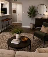 A living room with a couch, chair, and coffee table.