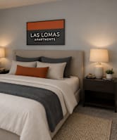 A bedroom with a bed, nightstands, and a painting on the wall.
