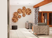 Thumbnail 6 of 13 - A room with a large wall art and a sofa.