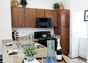 Thumbnail 4 of 29 - A view of the Kitchen in the 1200 Acqua model apartment home