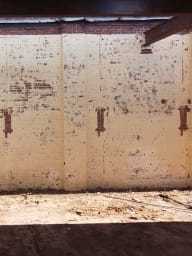 Interior walls of Converse Mill Lofts before restoration.