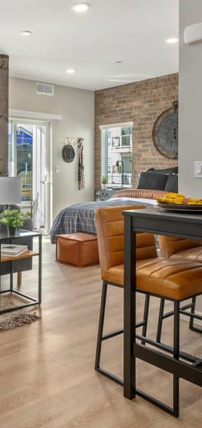 a living room with a bar and a dining room
