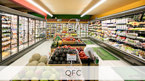 A supermarket aisle with a variety of fruits and vegetables on display.at Axle, Seattle Washington