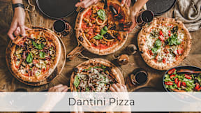 A group of people enjoying a meal of Dantini Pizza.at Axle, Washington, 98119