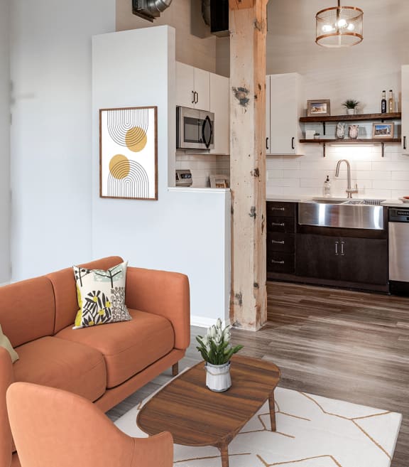 a small kitchen with a stainless steel sink and wooden shelves
