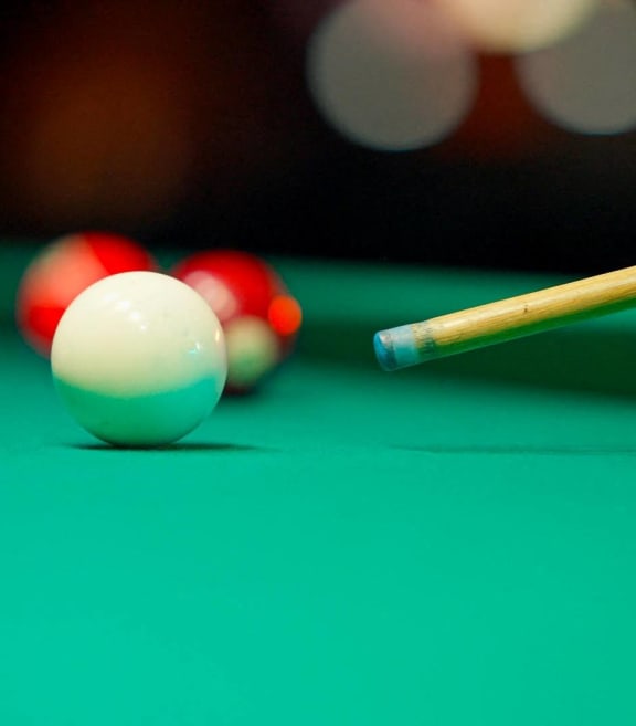 Close Up of Person Playing Pool