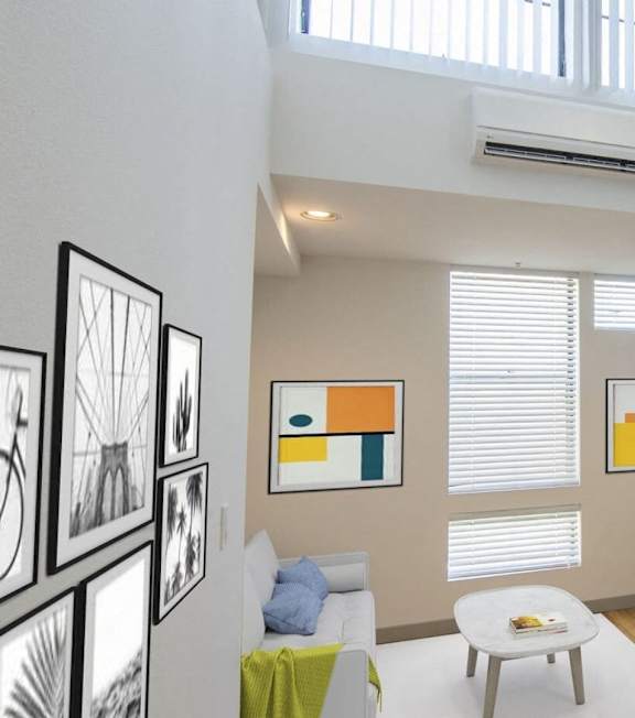 a living room and dining room with white furniture