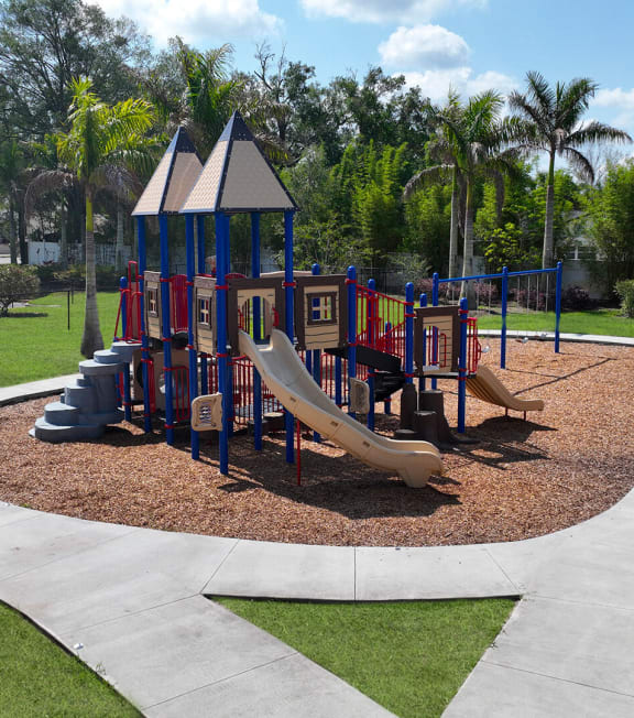 a playground in a park on a sunny day