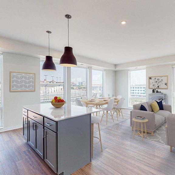 a kitchen and dining room with a table and chairs at Odyssey, Fort Myers, FL, 33905