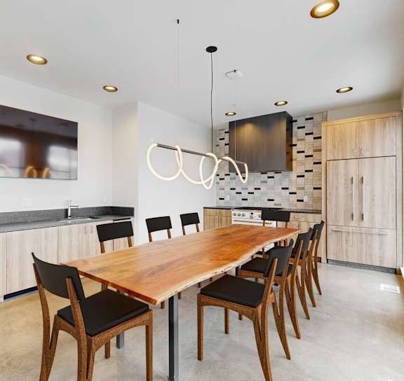 a kitchen and dining room with a table and chairs at One West Drive Apartments, Excelsior, Minnesota
