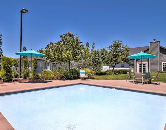 Community pool with spa jets and sundeck at Rosemeade Apartments, Roseville
