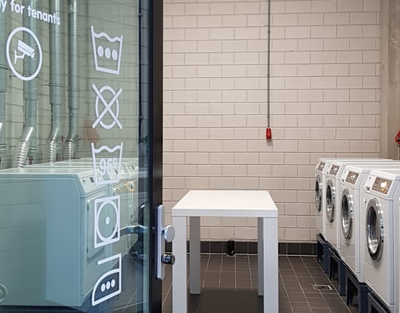 A laundromat with a sign that says "only for tenants" is shown.