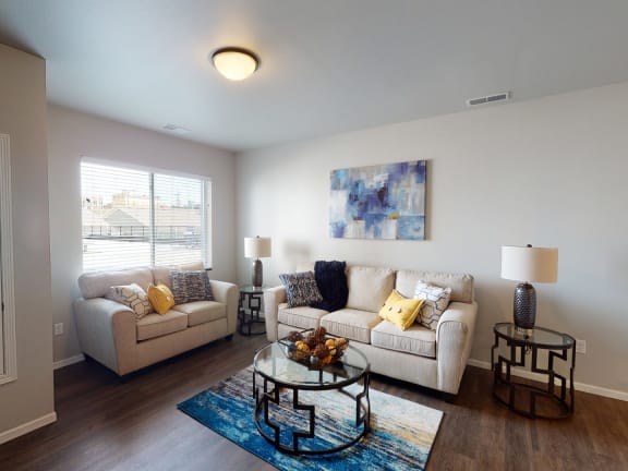 a living room with couches and a coffee tableat First Street Lofts in Downtown Bismarck, North Dakota, 58506
