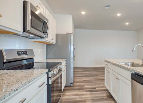 Kitchen with granite counter tops and stainless steel appliances at The Mark, Harrisonburg, VA, Virginia