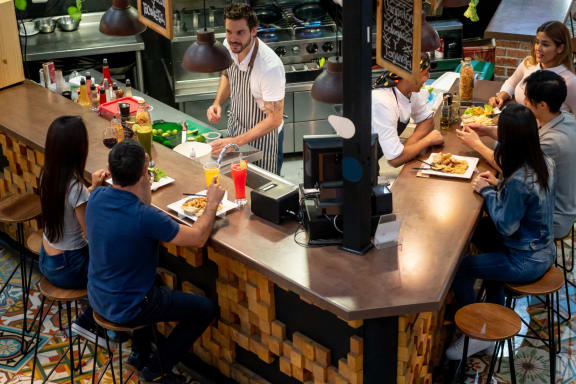 a group of people sitting at a table in a restaurant at Park Ridge Estates, Durham