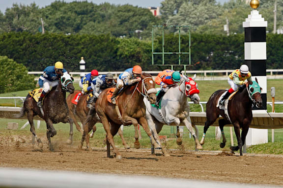 a group of horses and jockeys racing on a track at Chinoe Creek Apartments, Lexington, KY, 40502